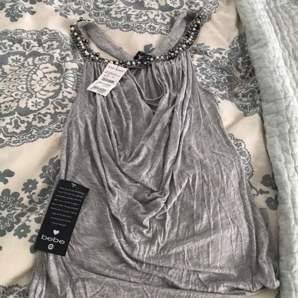 Women’s beaded neck keyhole jersey top